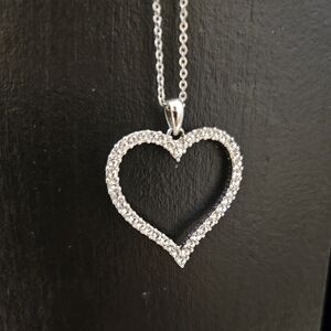 Heart Shaped Silver Necklace With Small Glass Crystals Surrounding The Heart